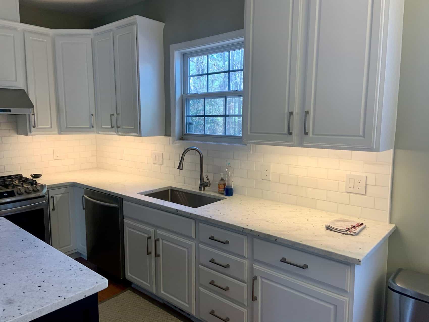 kitchen with indoor lighting and white cabinets