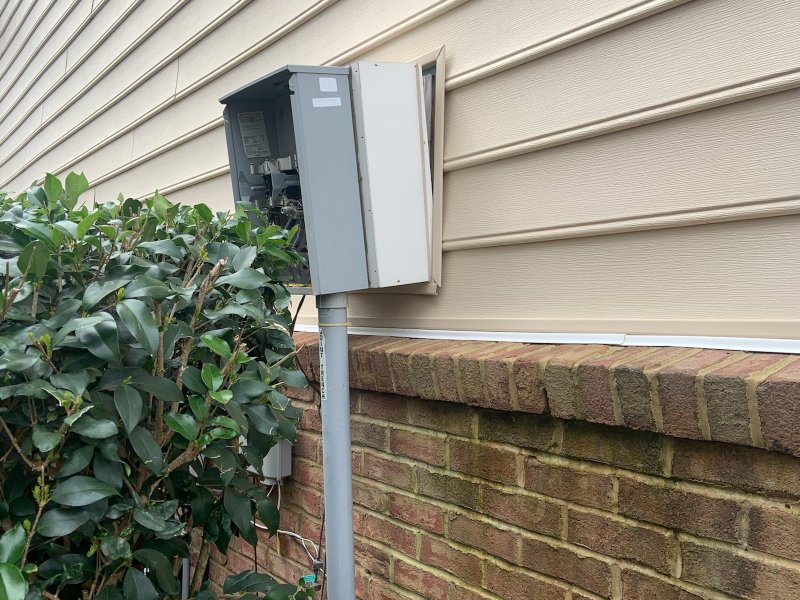 circuit breaker control box outside of beige home