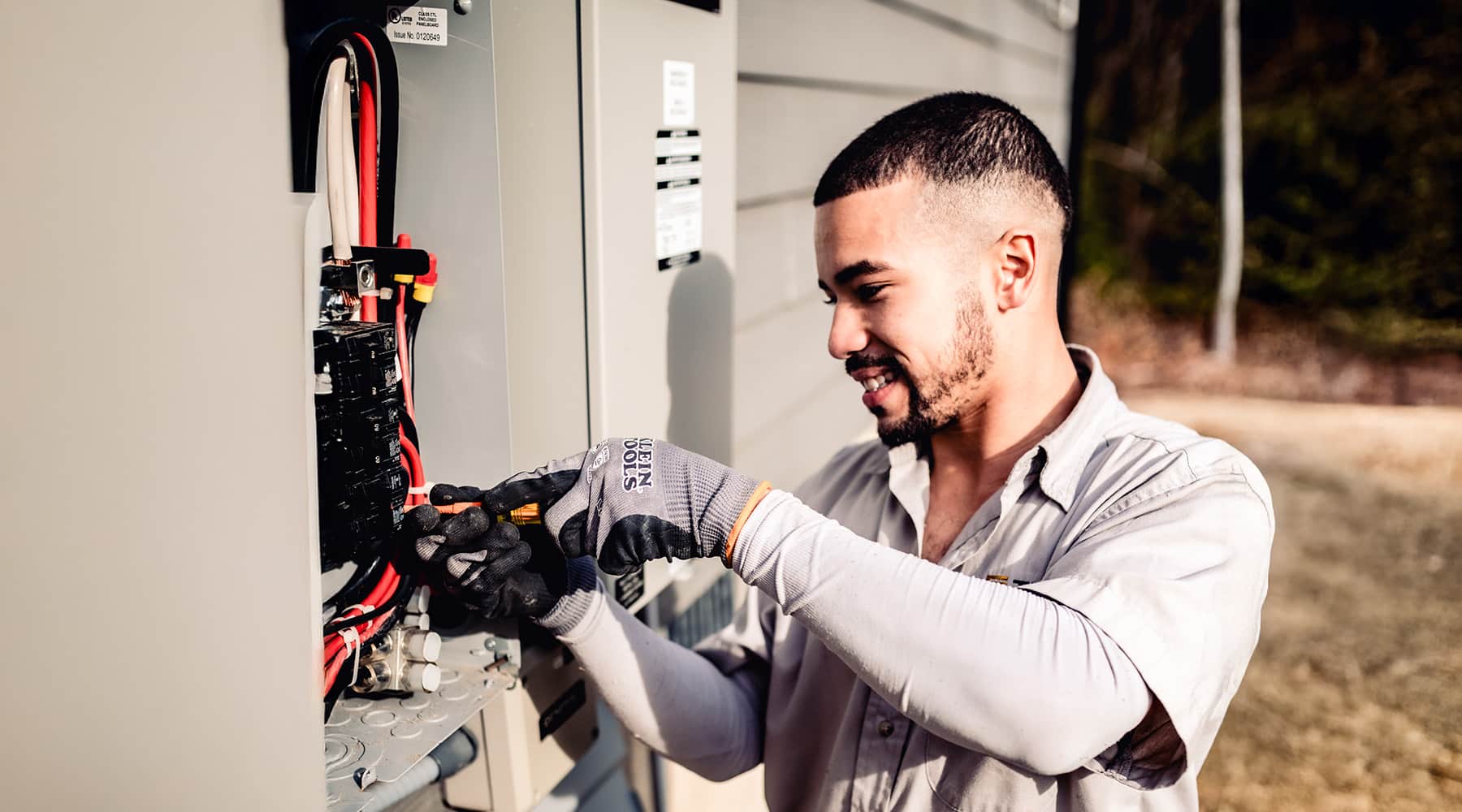 Bee Bright electrician working on a electrical panel